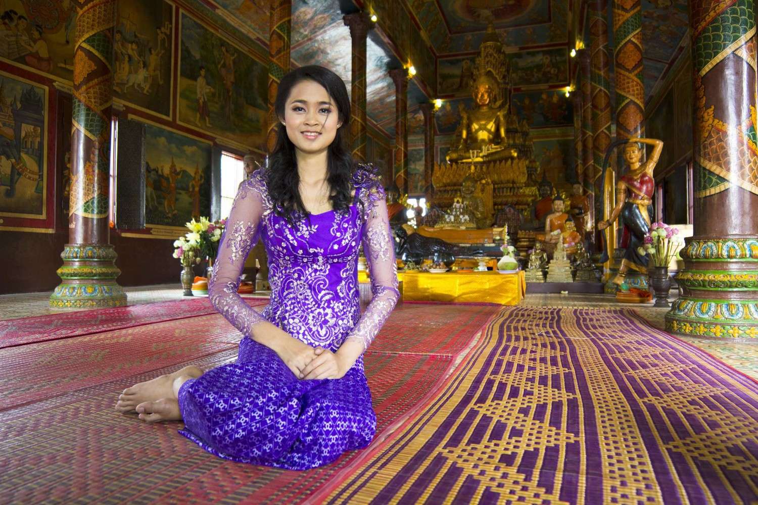 Woman Praying In Wat Pagoda Phnom Penh Cambodia