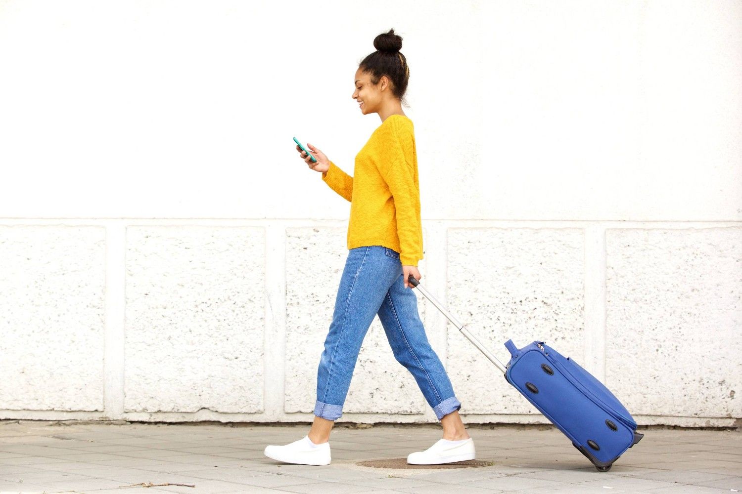 Woman Walking With A Travel Bag